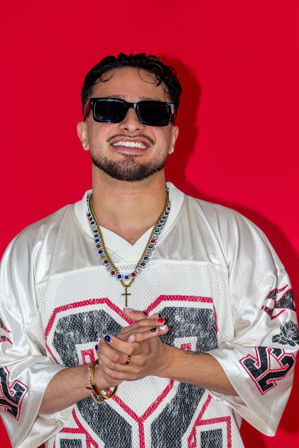 Portrait against a vivid red studio background